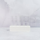 "Front view of empty MATTE WHITE Propagation Station, featuring five clear tubes in a sleek, minimalist white block."